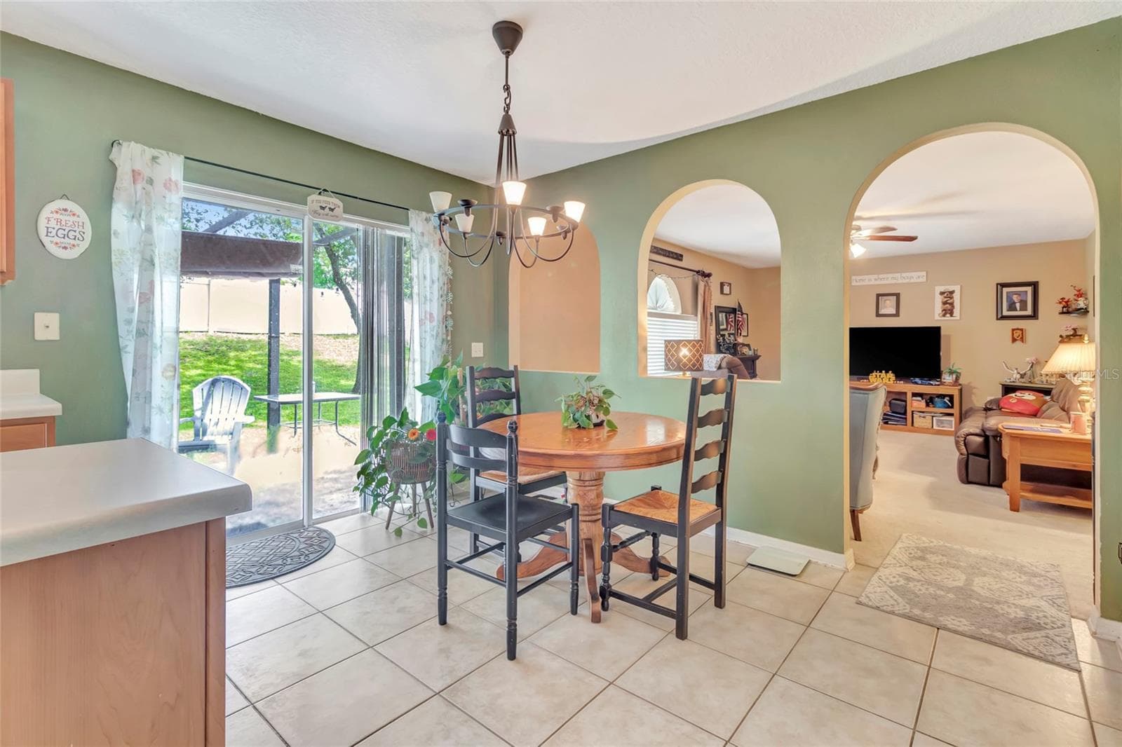 Eating Space in Kitchen with sliding glass doors to Lanai - 216 TRES REYES LN, GROVELAND