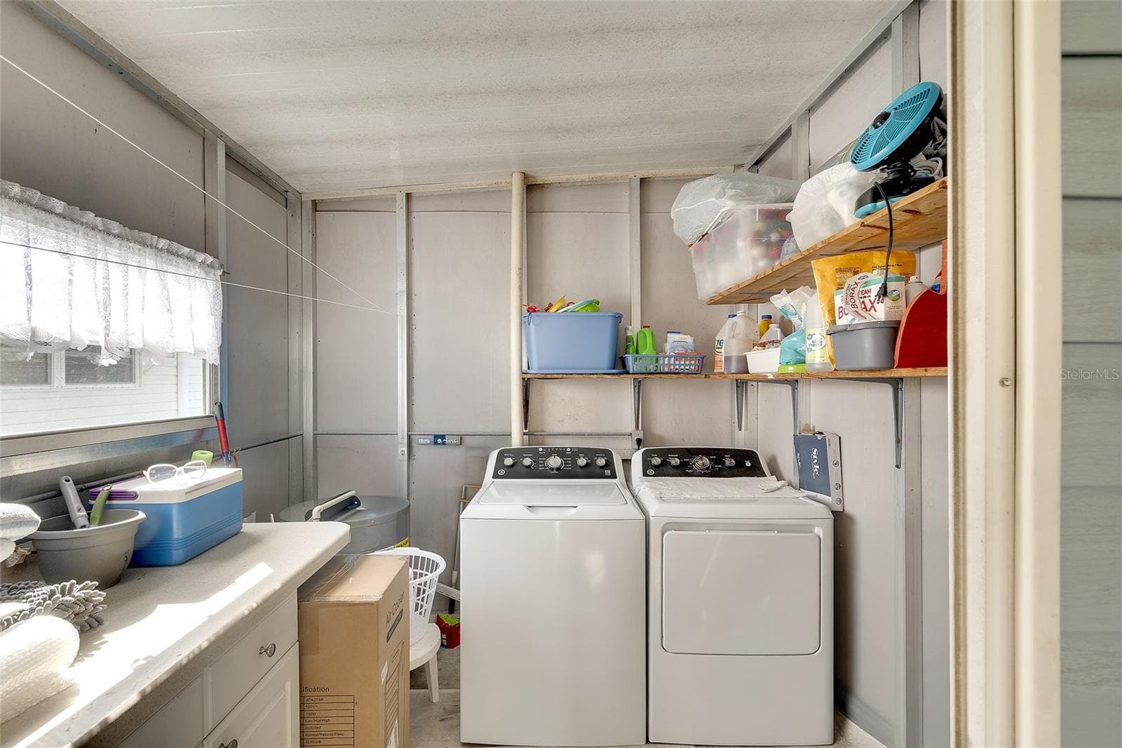 separate laundry area , NEW washer/dryer with additional storage - 2062 CHAMPION ST, SARASOTA