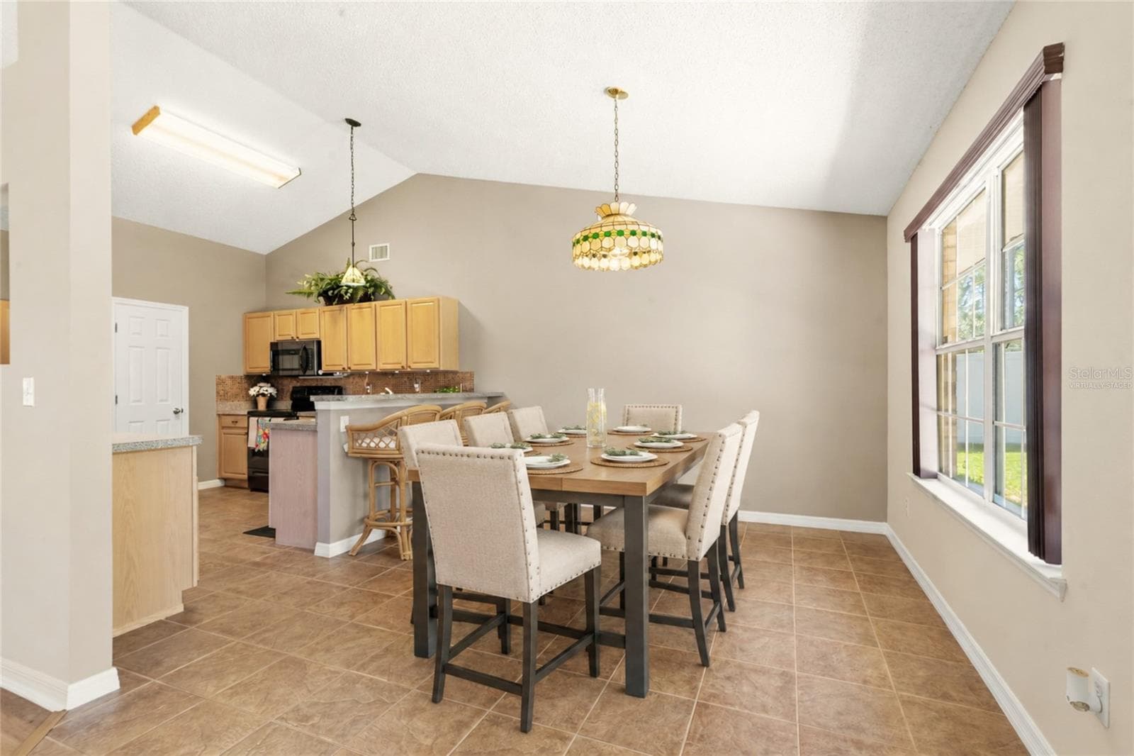 Virtually Staged Breakfast Nook View from the Great Room - 38 PRINCESS ROSE DR, PALM COAST