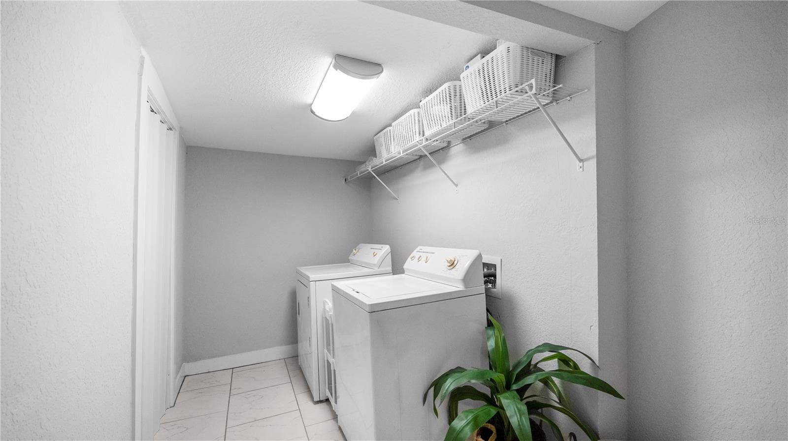 Laundry Room with storage closet and attic access - 730 COLLEGE AVE, LAKELAND