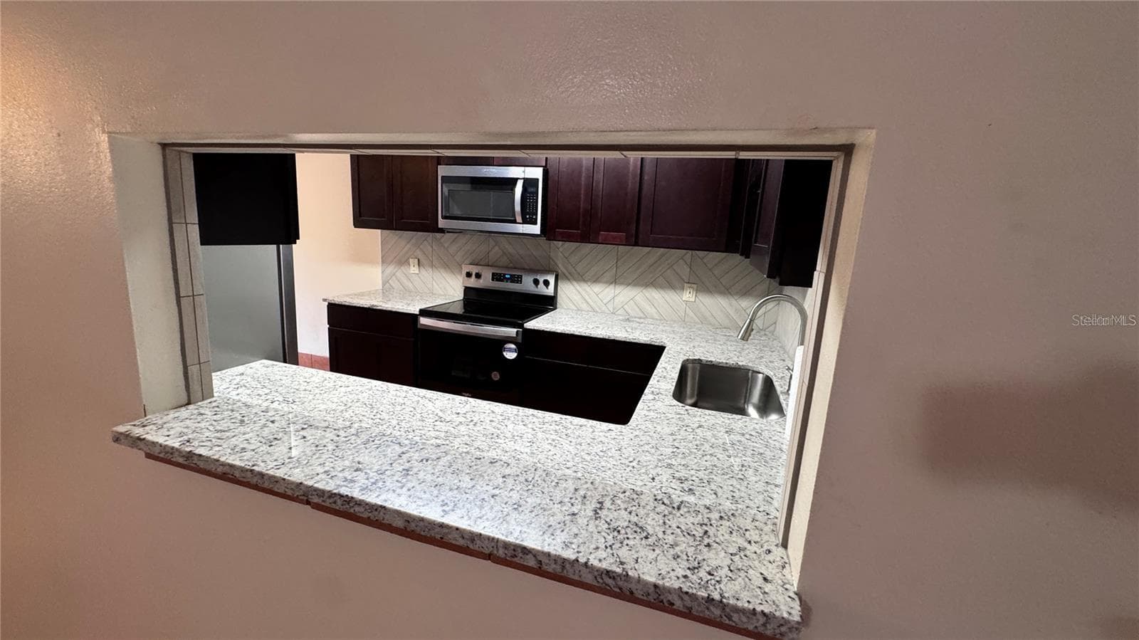 Kitchen from Dining Room Serve Window - 2657 EXUMA WAY, WINTER PARK
