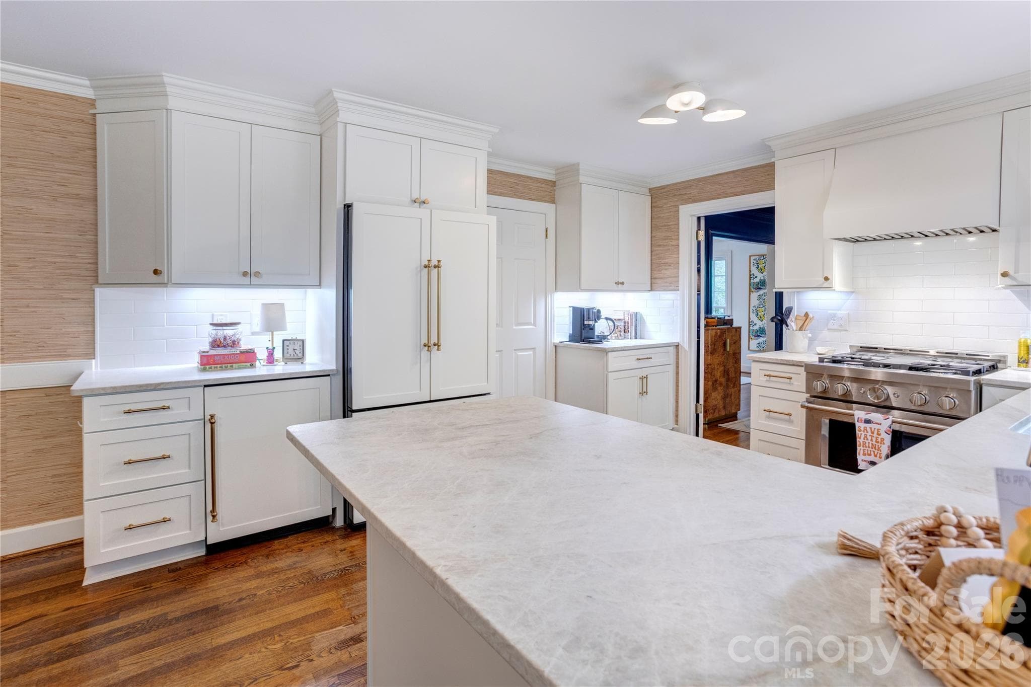 Paneled fronts on the refrigerator and wine cooler blend seamlessly with the cabinetry. - 215 Bethel Drive, Salisbury