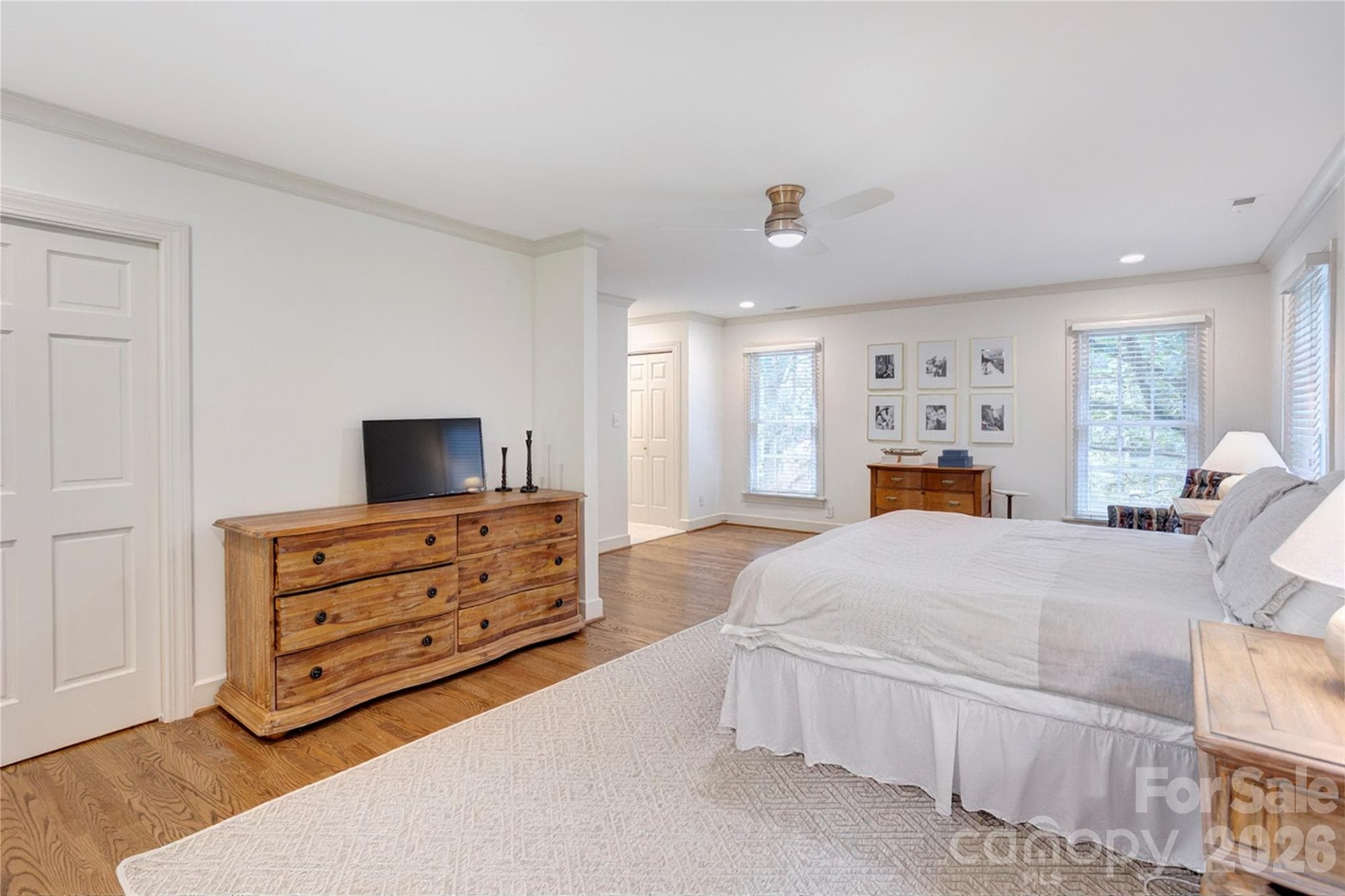 New hardwoods flow seamlessly into the primary bedroom. - 215 Bethel Drive, Salisbury