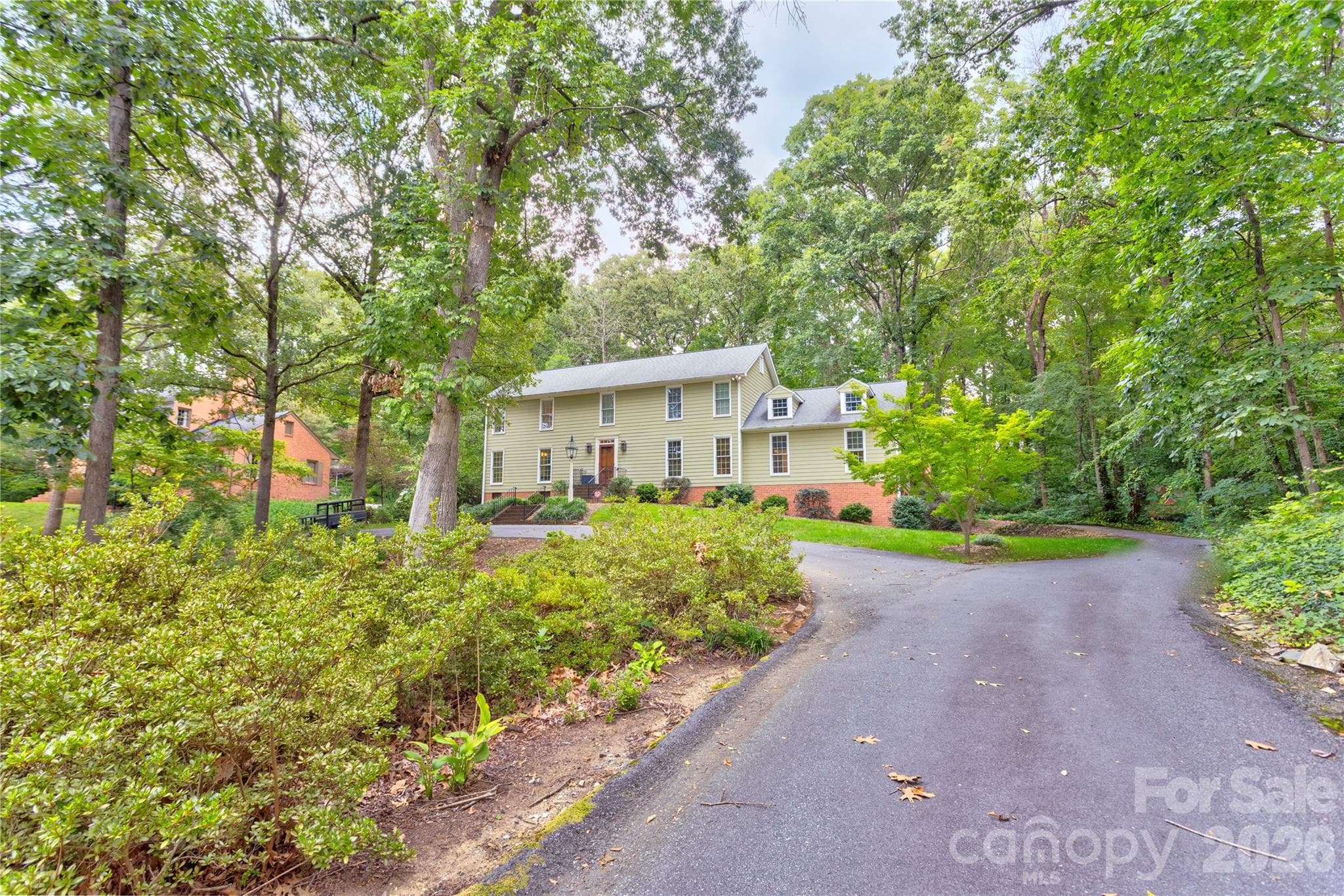 Follow the circular driveway and veer right to reach the two car garage. - 215 Bethel Drive, Salisbury