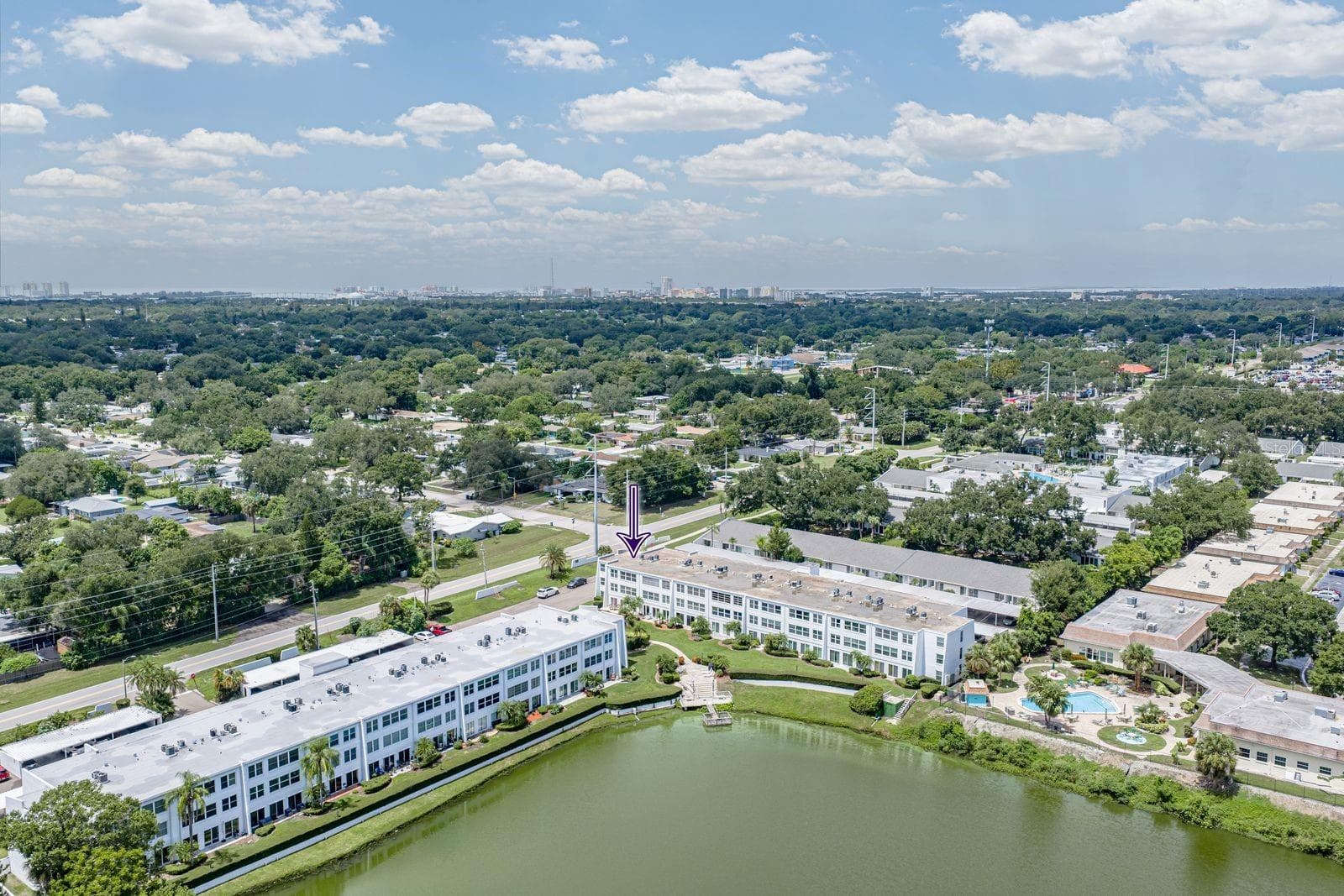 Camera facing NW. Downtown and Clearwater beach on the horizon. FYI, the pool in lower right corner is NOT part of Penthouse Groves - 1655 S HIGHLAND AVE #I379, CLEARWATER