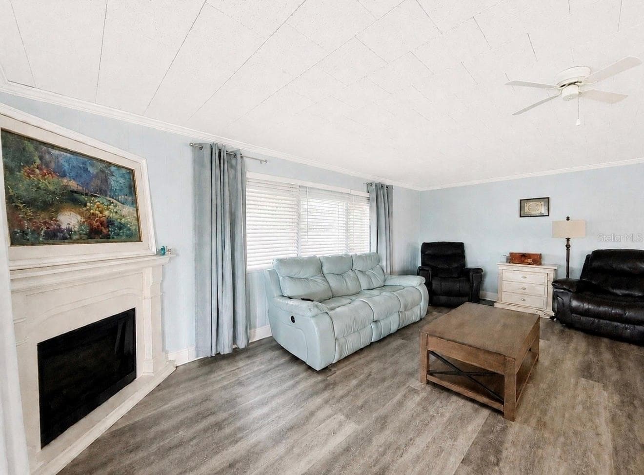 Living room with electric Fireplace - 1100 BELCHER RD S #304, LARGO