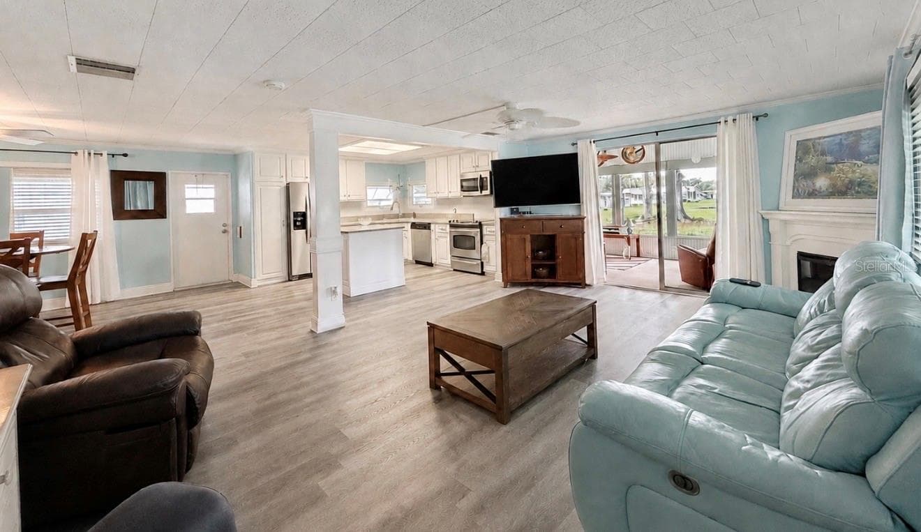 Living room to kitchen and dining room all open - 1100 BELCHER RD S #304, LARGO
