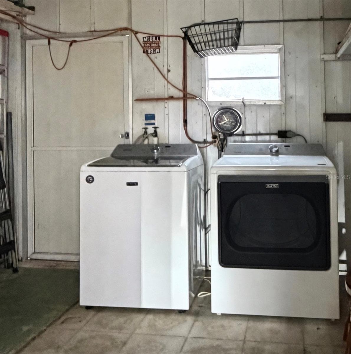 washer and dryer in shed under carport - 1100 BELCHER RD S #304, LARGO