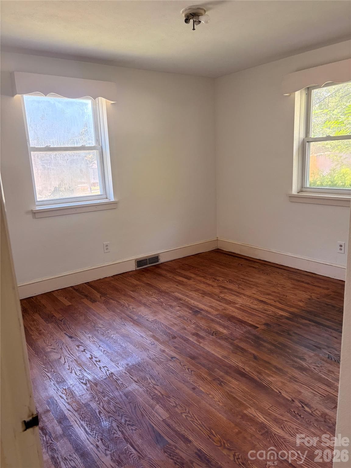 Bedroom with newly refinished wood flooring - 725 5th Avenue SW, Hickory