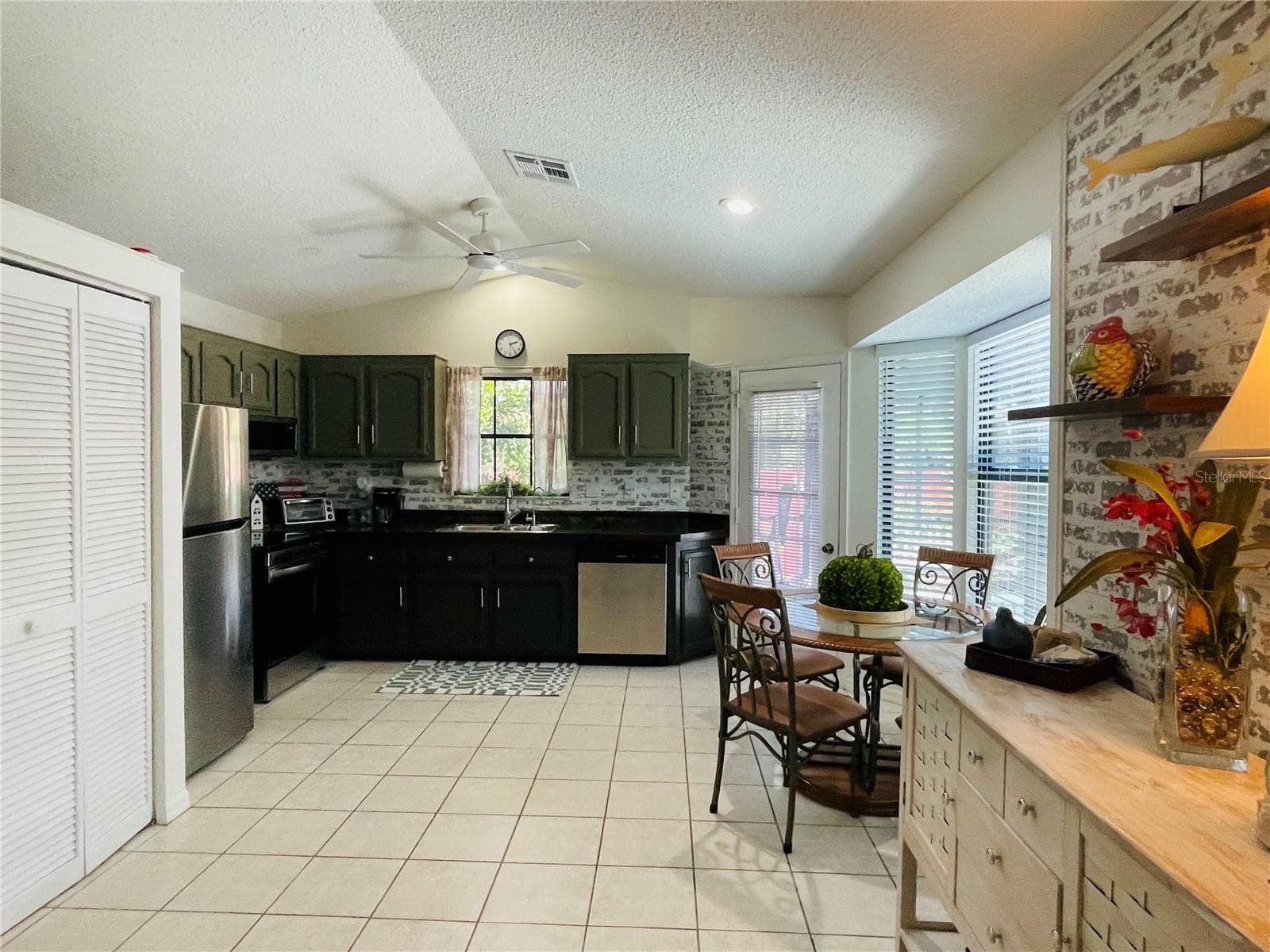 LIVING ROOM TO KITCHEN - 255 BOUNDARY BLVD #104, ROTONDA WEST