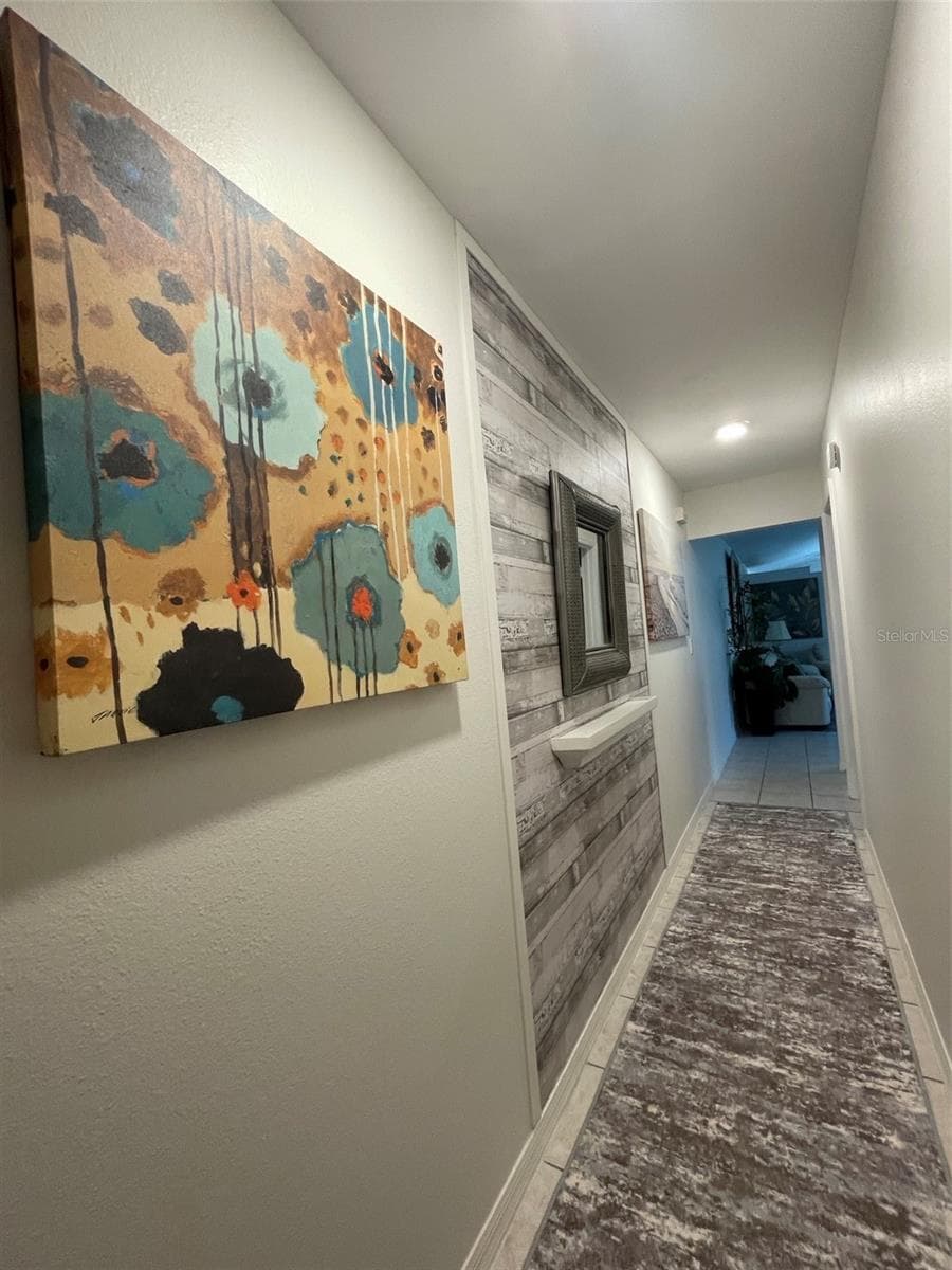 HALLWAY FROM BEDROOMS TO LIVING AREA - 255 BOUNDARY BLVD #104, ROTONDA WEST