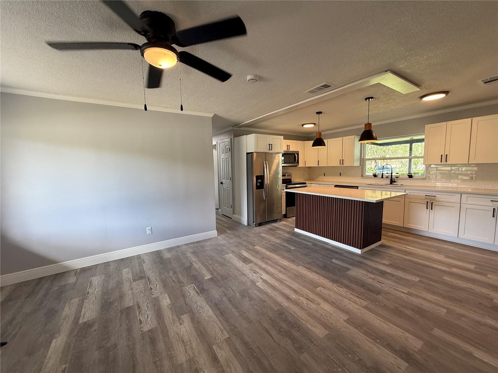 living room and connected kitchen - 1000 E DIXIE AVE, LEESBURG