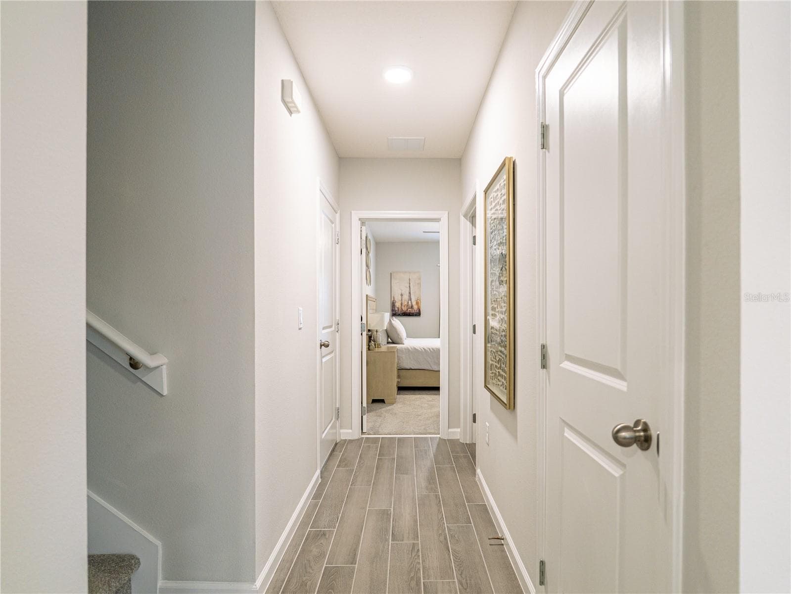 Hallway from Kitchen to stairs and 1st floor bedroom and full bathroom - 4902 LIVINGSTON LN, OVIEDO