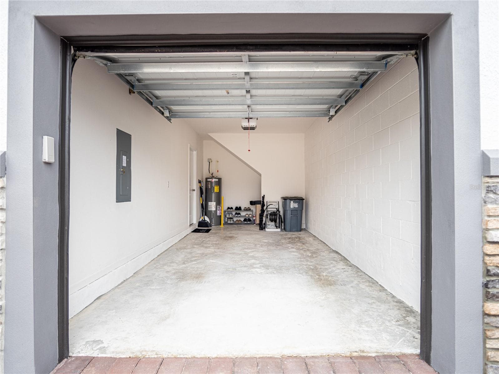 1-Car Garage, Water heater and Storage behind wall on right - 4902 LIVINGSTON LN, OVIEDO