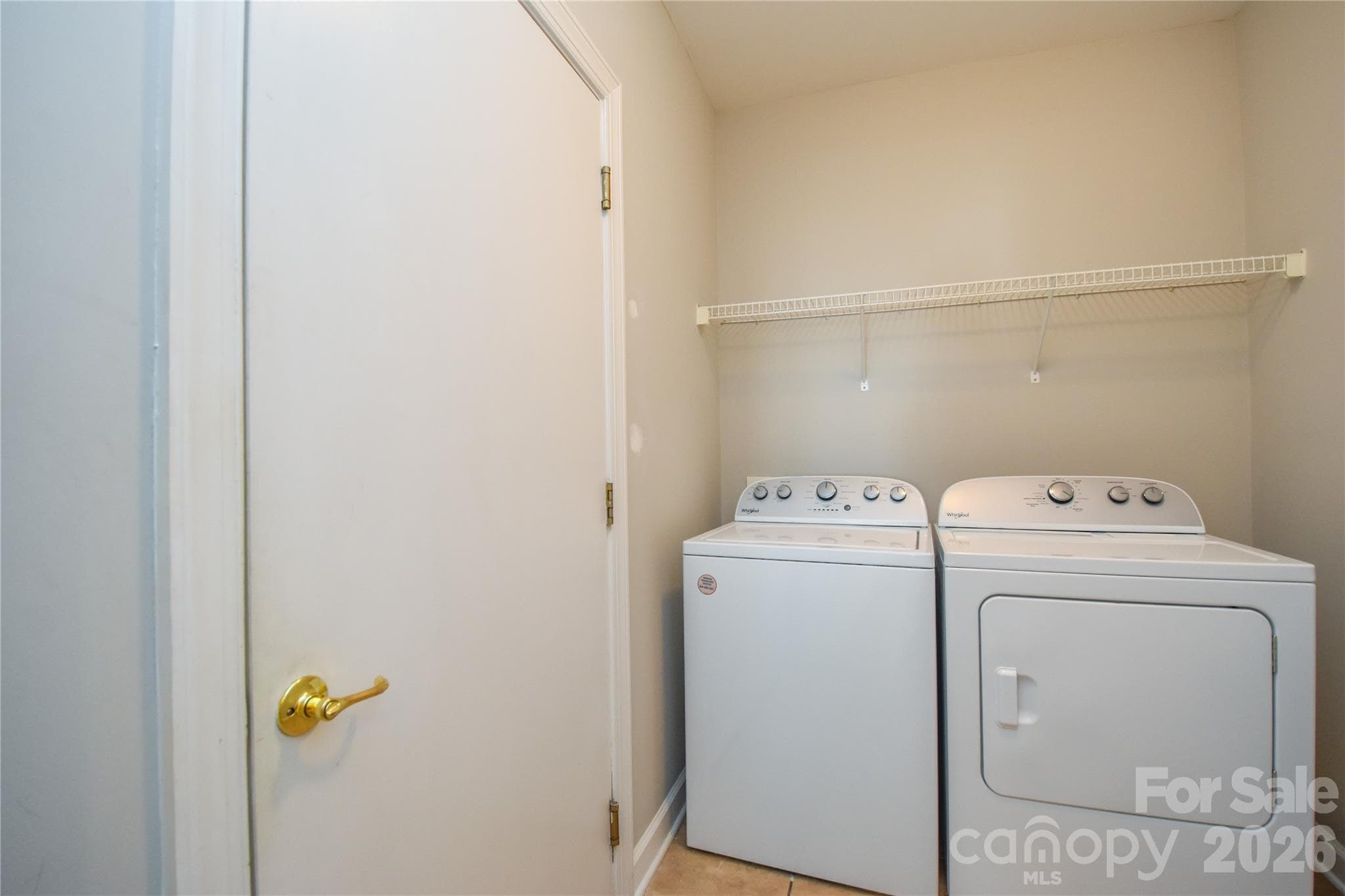 In the laundry is the access to the oversized 2 car garage. - 8332 Highland Glen Drive, Charlotte