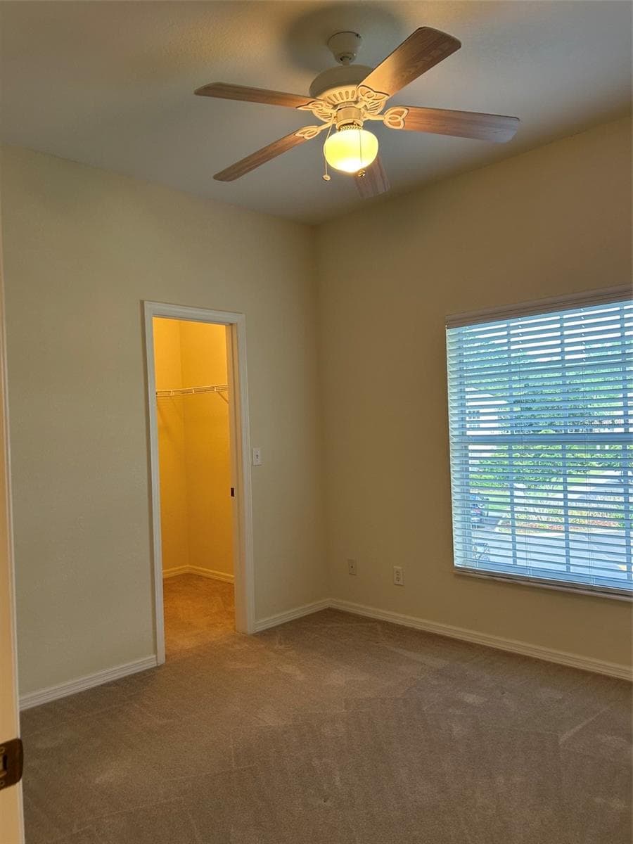 Bedroom #2 with walk in closet - 508 EAGLE POND DR #508, WINTER HAVEN