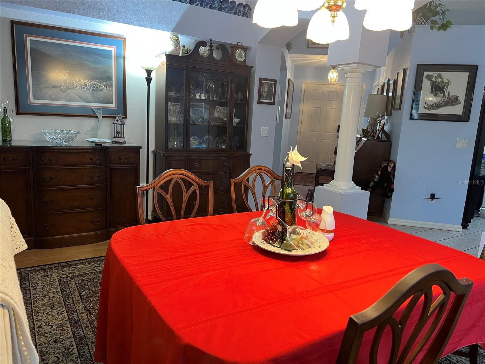 Dining Room with Chandelier, Hallway to Front Door - 1842 PUERTO BELLO DR, THE VILLAGES