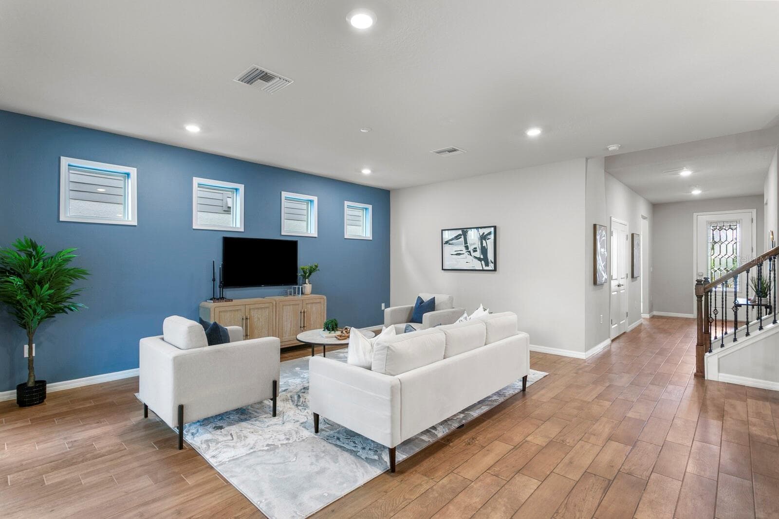 Wood-look ceramic tile floors throughout main living areas - 18908 WILLOWMORE CEDAR DR, LUTZ