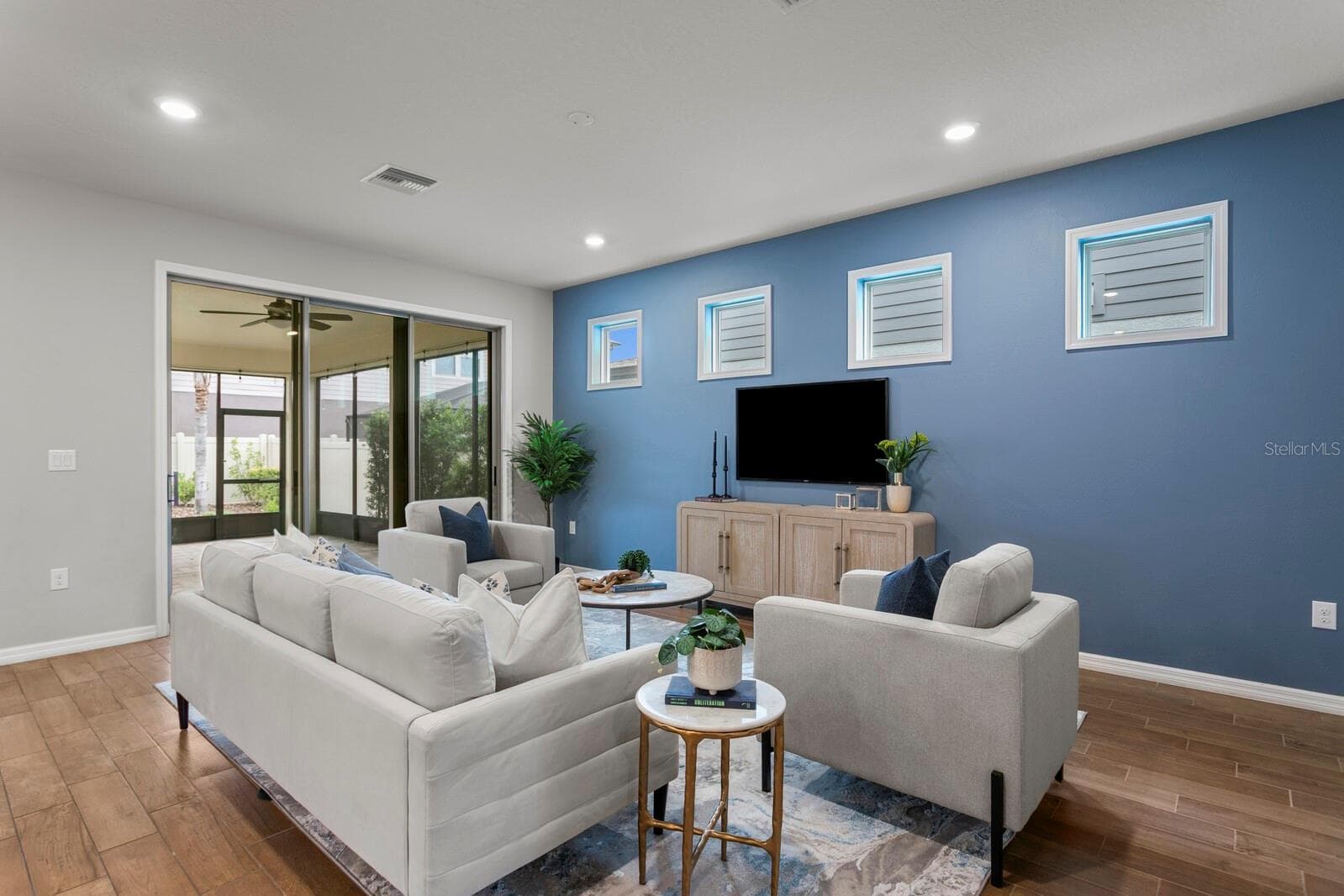 Triple sliding glass doors out to lanai - 18908 WILLOWMORE CEDAR DR, LUTZ