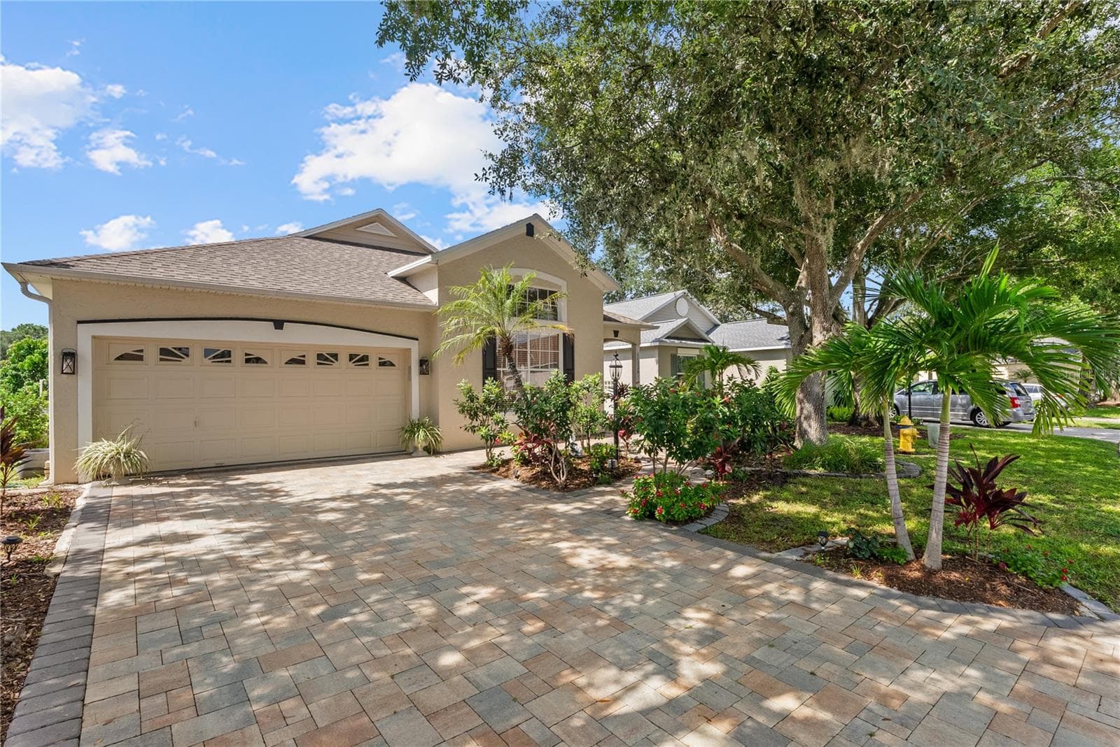 New paver driveway and walkways, with a freshly landscaped yard. - 11326 BLUE SAGE PL, LAKEWOOD RANCH