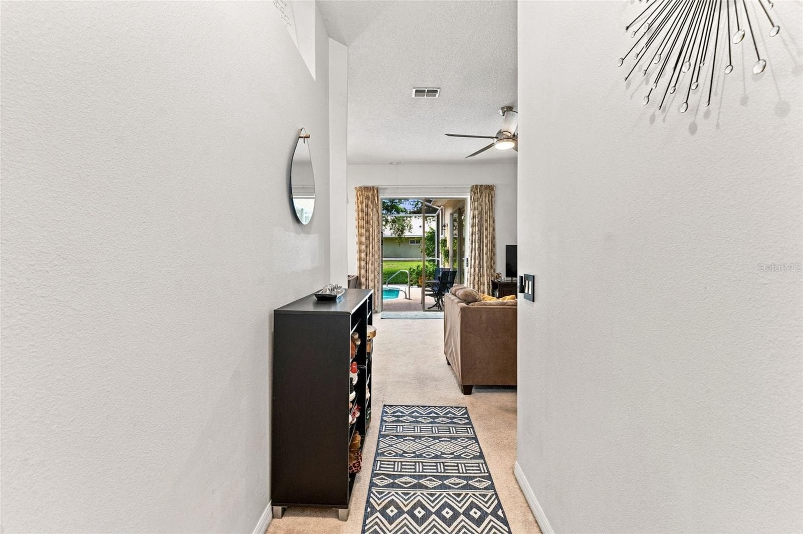 Welcoming entry that opens right up to the slides and pool - 491 BRILAND ST, TARPON SPRINGS
