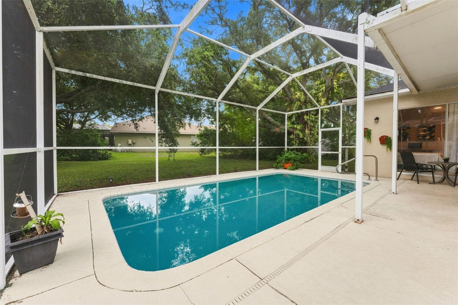 Large pool and lanai, great place for your morning coffee. - 491 BRILAND ST, TARPON SPRINGS