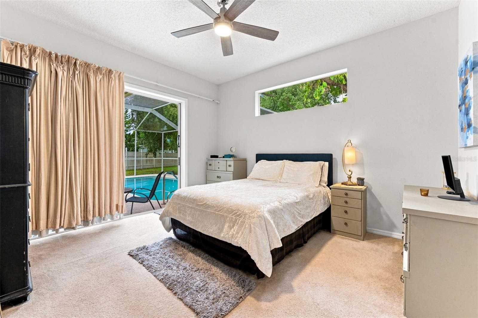 Primary bedroom with oversided walk-in close, en-suite bathroom with dual sinks and high ceilings - 491 BRILAND ST, TARPON SPRINGS