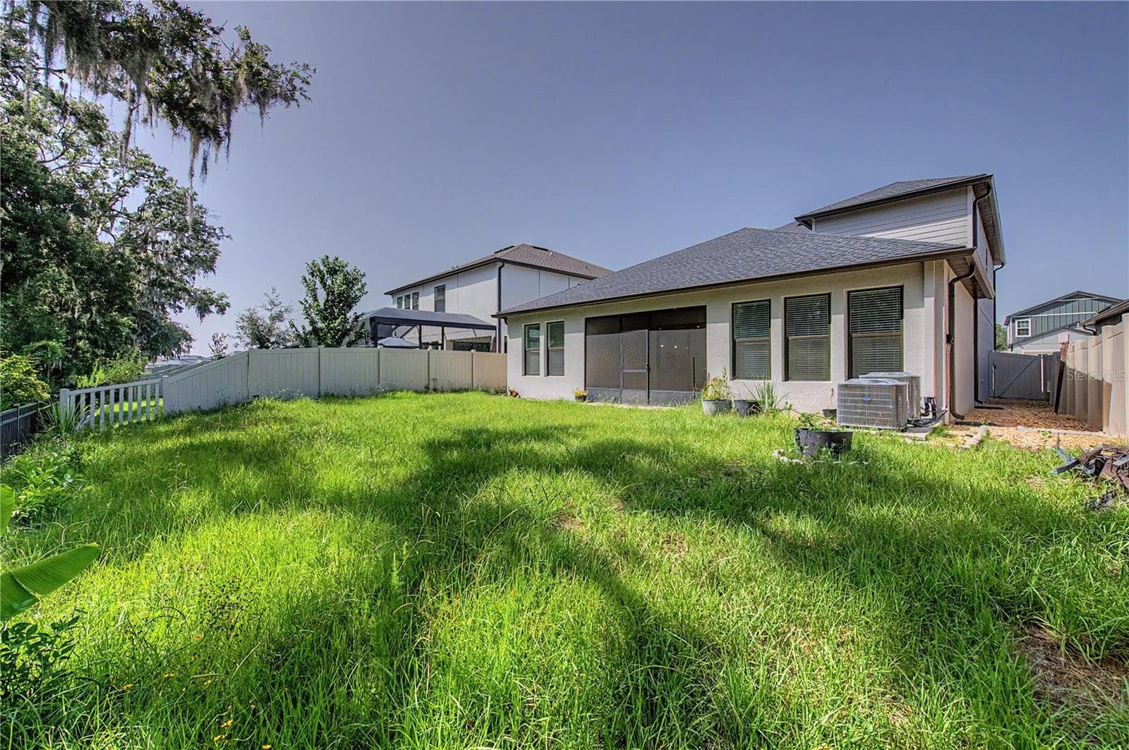 Back View of House - 9826 CARABINER WAY, LAND O LAKES