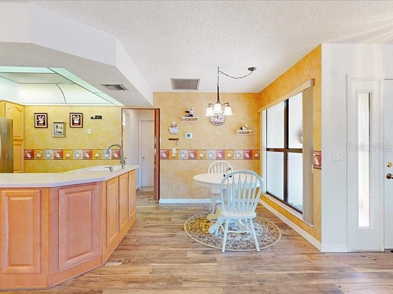 As you enter you are near the kitchen and a lovely window to bring in the natural sunlight - 118 COVENTRY LN, HAINES CITY