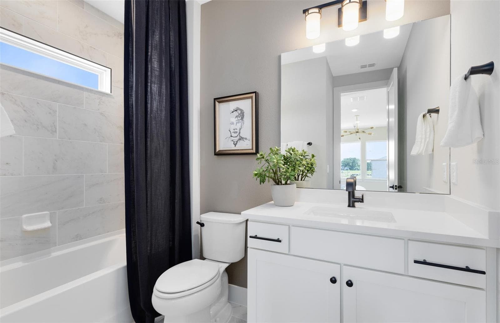 Actual home photo. Colors, finishes, textures and options may appear differently in person due to variations in monitors and viewing devices. - 16920 LONE OAK CIRCLE, ORLANDO