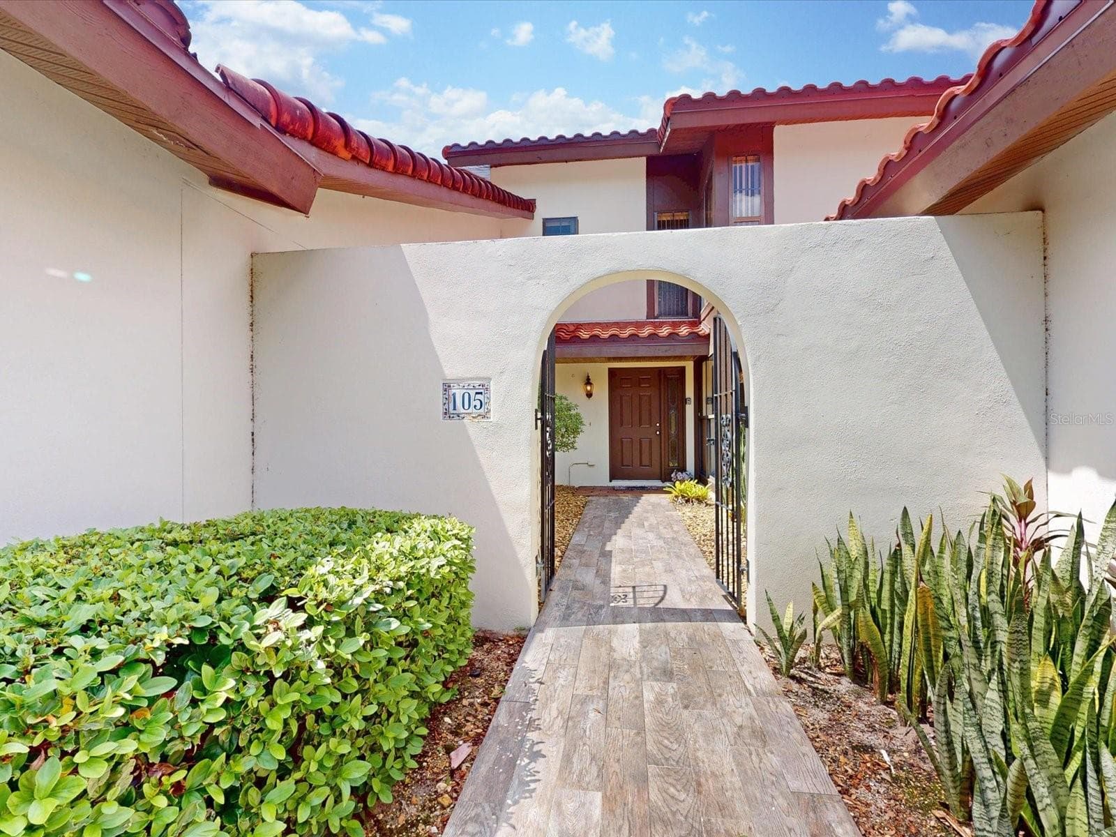 Enter the gate to see your new front door - 105 COVENTRY LN, HAINES CITY