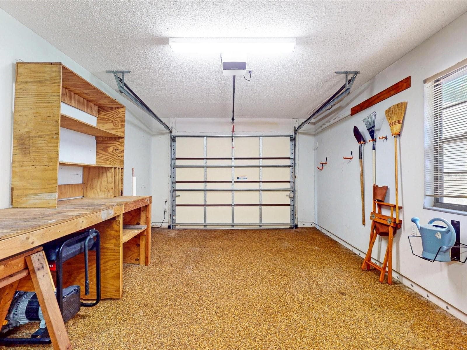 A quick look into the well maintained garage - 105 COVENTRY LN, HAINES CITY