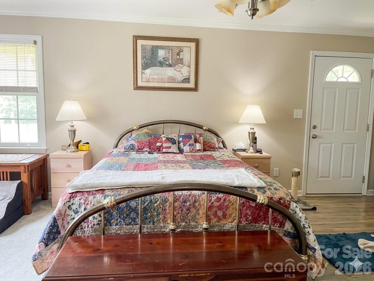 PRIMARY BEDROOM WITH PRIVATE DOOR TO ENTER ONE OF THE SCREENED IN PORCHES - 2323 Cherry Road, Catawba