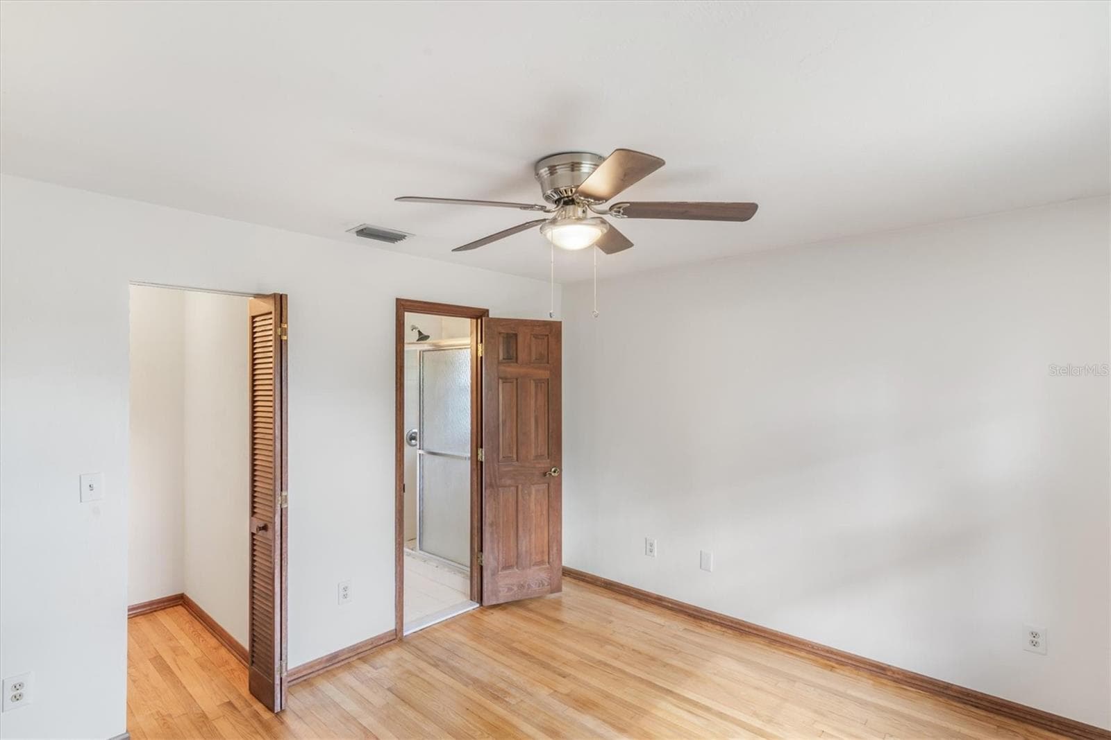 2 Bedroom with a walk-in closet and access to secondary bathroom - 1835 OAK PL, FLAGLER BEACH