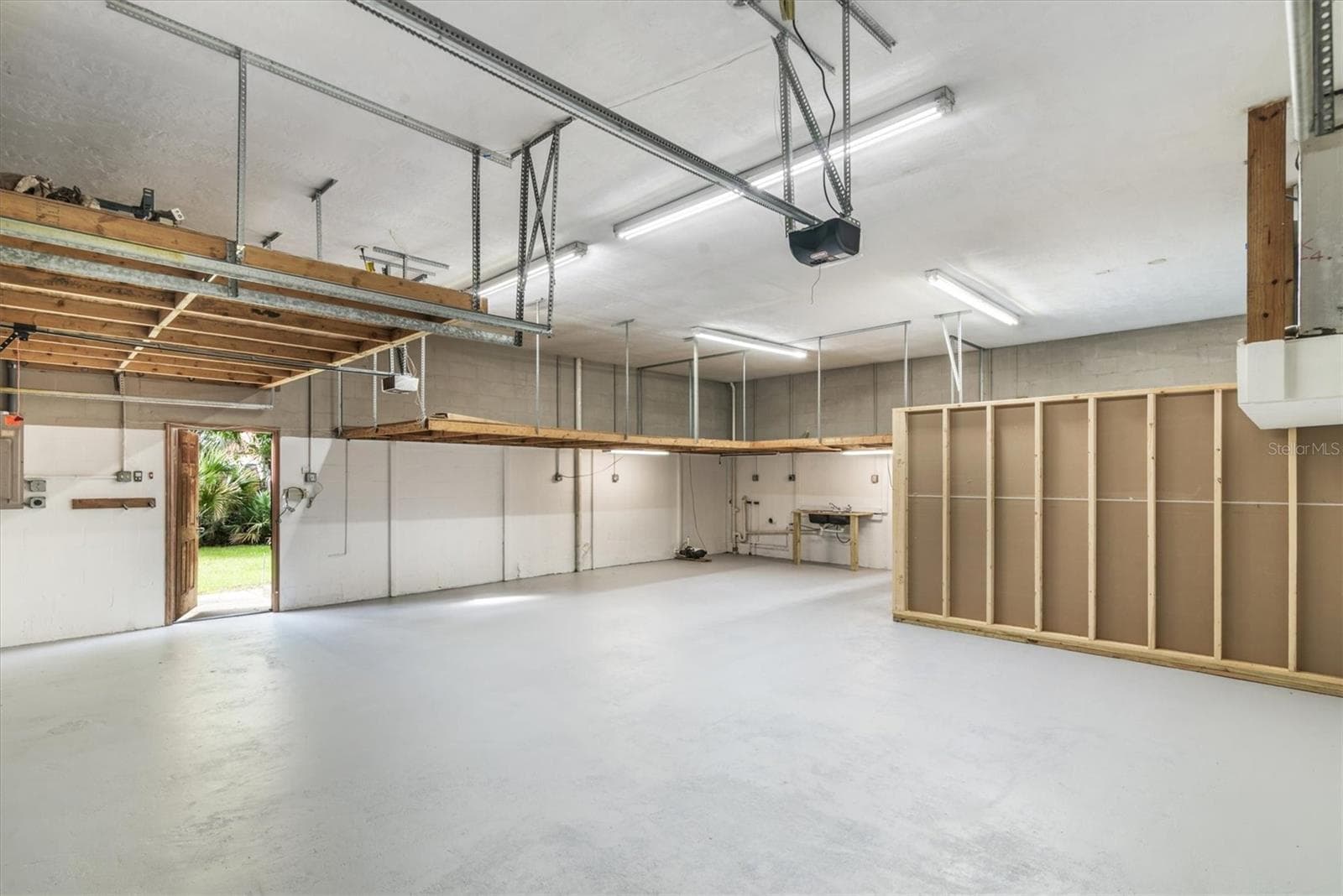 Garage has two lofts for storage and a partially finished area for an office or some other use - 1835 OAK PL, FLAGLER BEACH