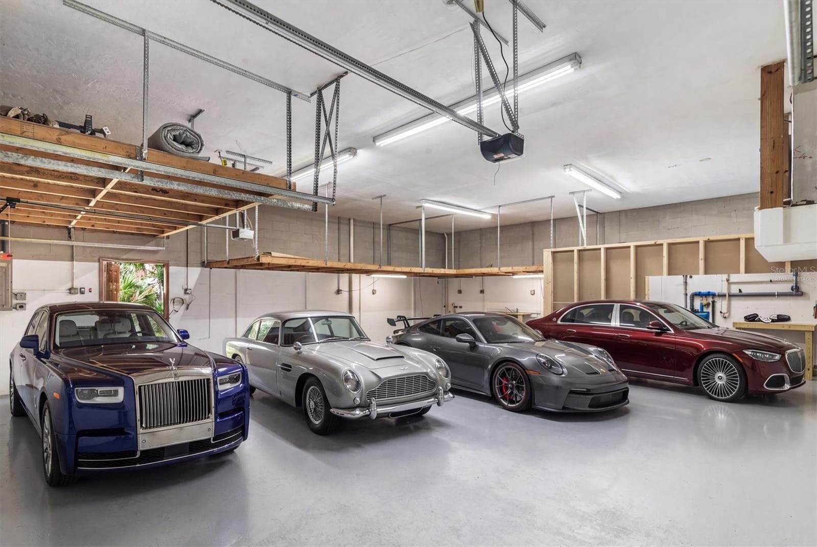 Garage virtually staged with vehicles - 1835 OAK PL, FLAGLER BEACH
