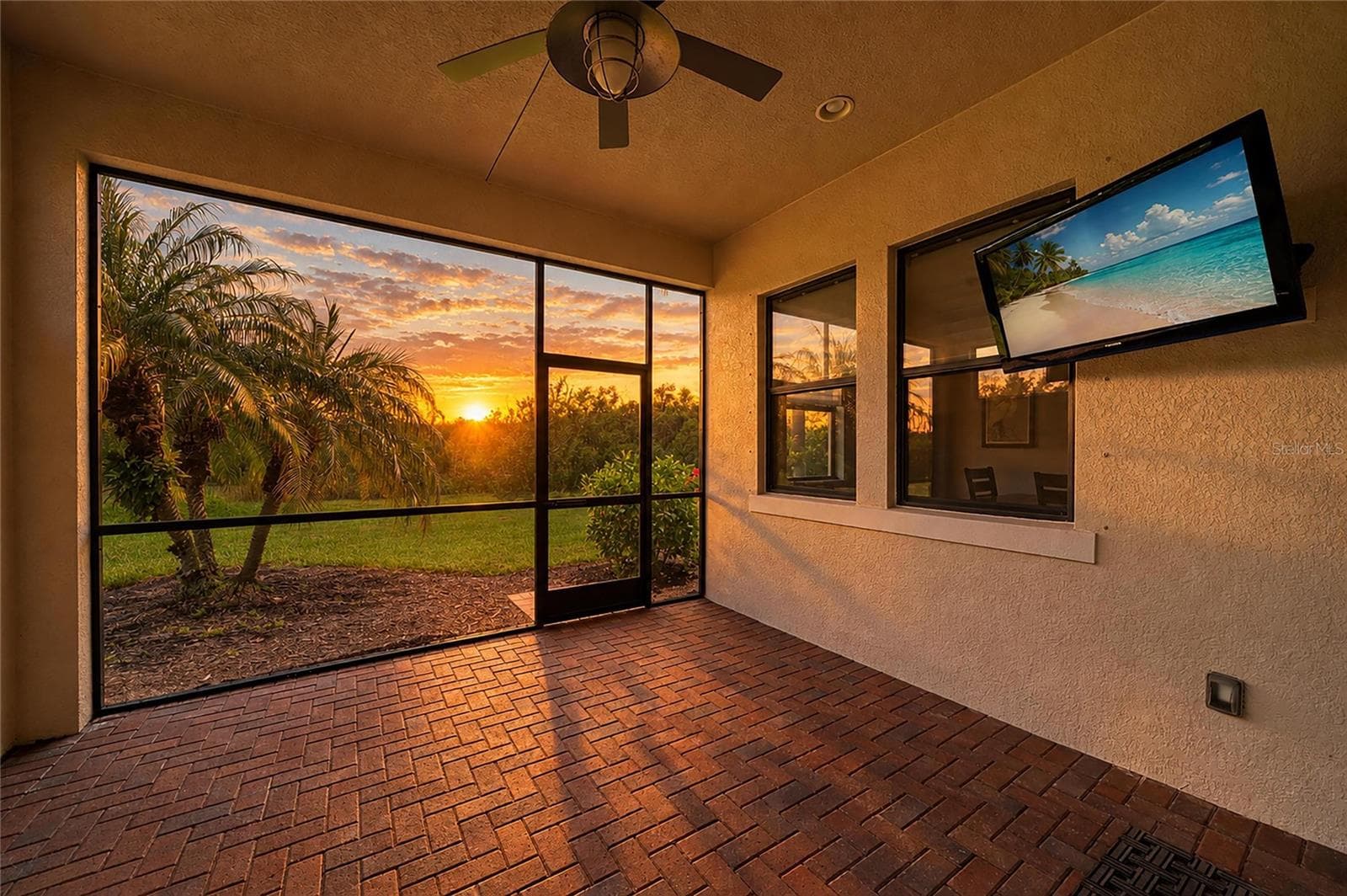 Back lanai at sunrise - 4645 ROYAL DORNOCH CIR, BRADENTON