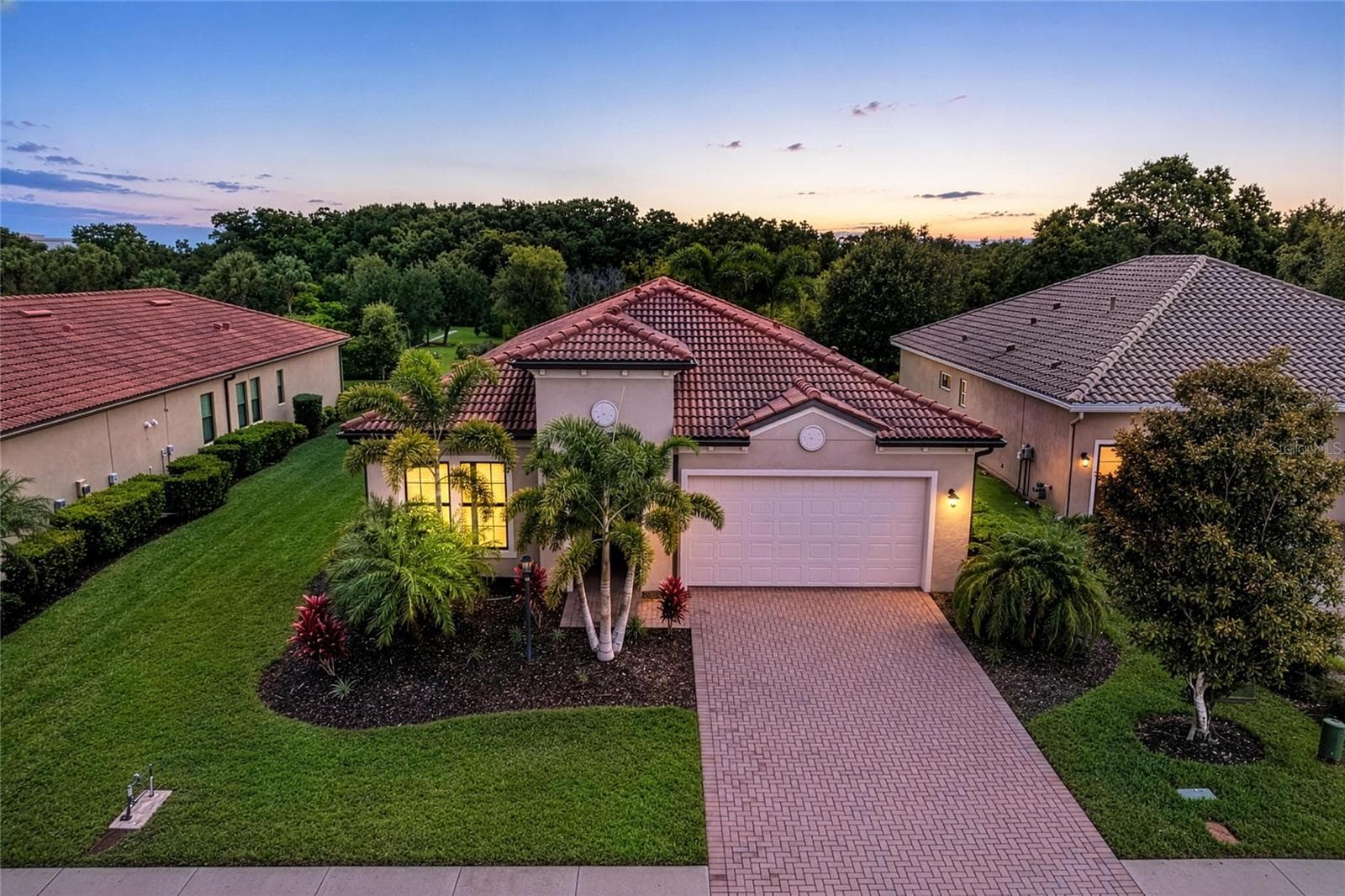 Front of home at sunrise - 4645 ROYAL DORNOCH CIR, BRADENTON