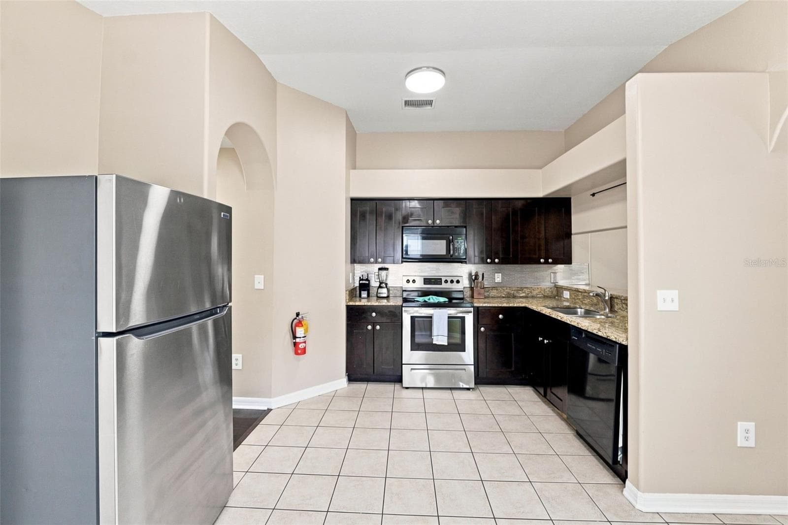 Spacious Kitchen with Stainless Steel Appliances - 6817 ARAMON CT, WESLEY CHAPEL