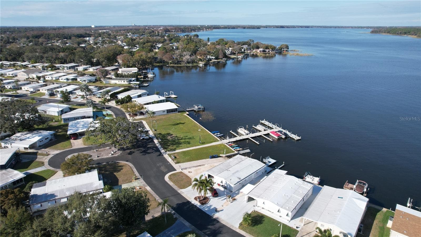Enjoy the ultimate 55+ lakeside lifestyle with direct access to our community fishing dock! - 183 PHILADELPHIA BLVD #22, PALM HARBOR