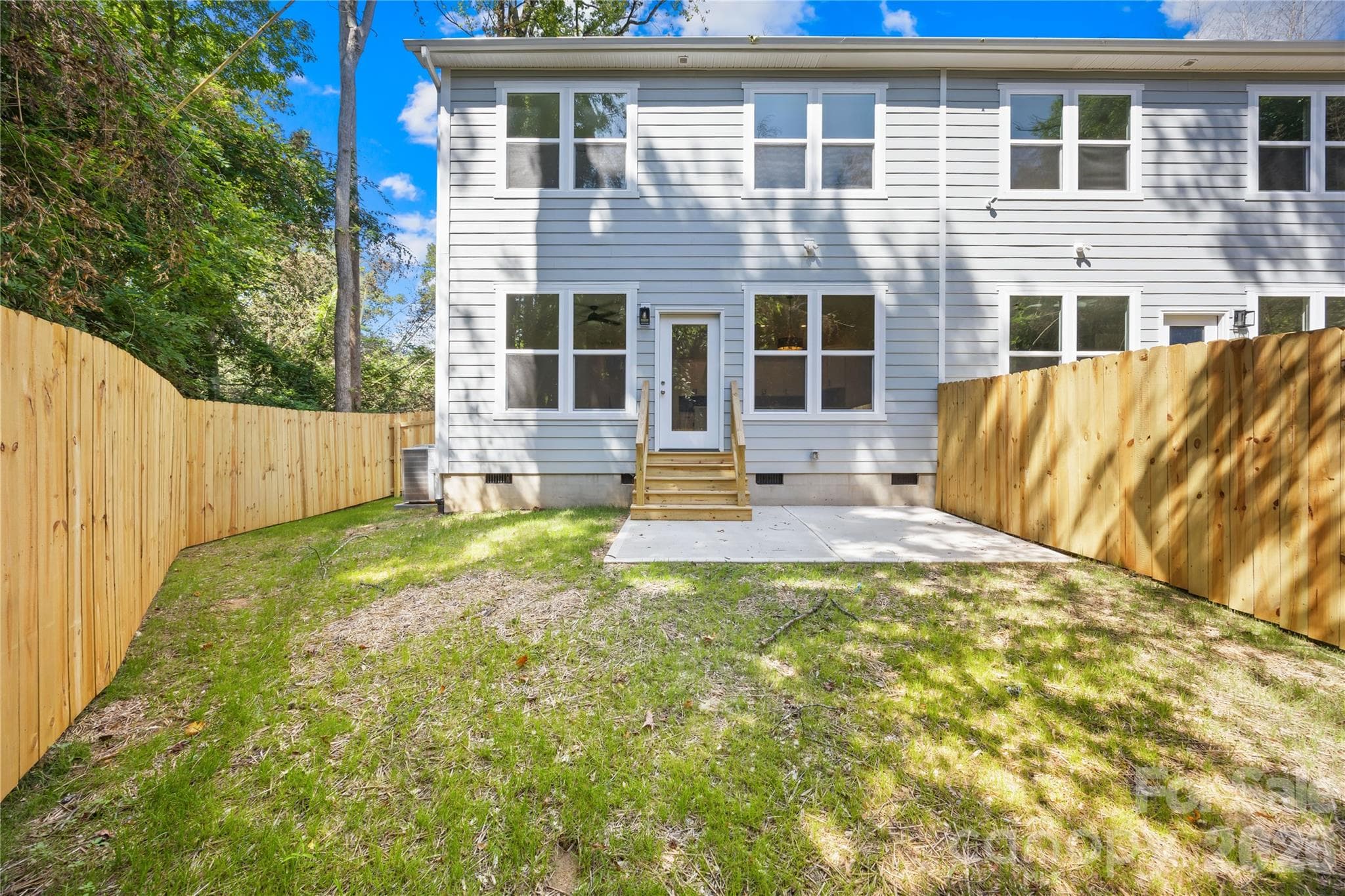 Private fenced backyard at 1940 Purser Dr, a new construction Charlotte duet with no HOA dues - 1940 Purser Drive, Charlotte