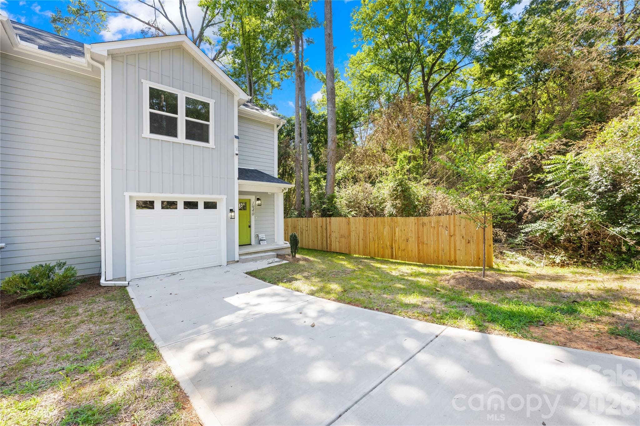 Concrete driveway and attached garage at 1940 Purser Dr in Eastwood Acres, Charlotte, NC 28215 - 1940 Purser Drive, Charlotte