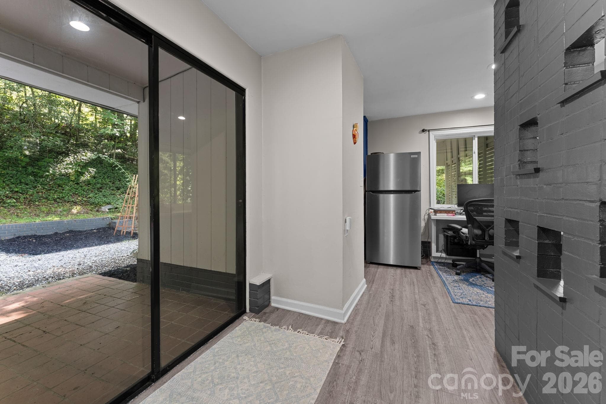 Slider to Back Patio, Kitchen and Office Nook Ahead - 103 Riverwood Drive, Sylva