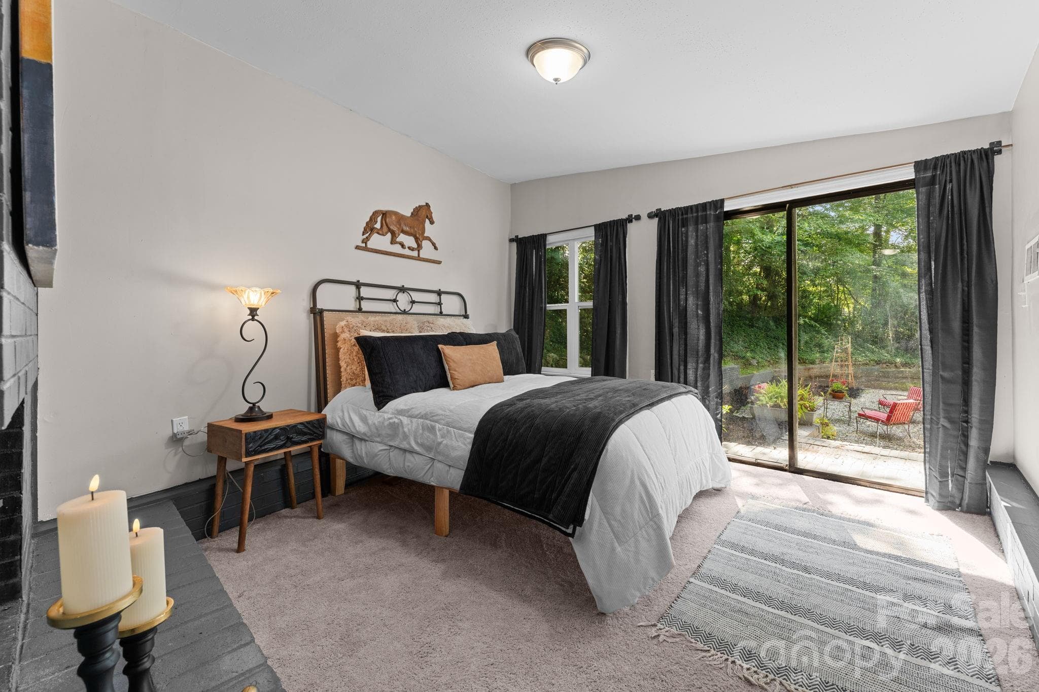 Primary Bedroom with Fireplace & Patio Access - 103 Riverwood Drive, Sylva