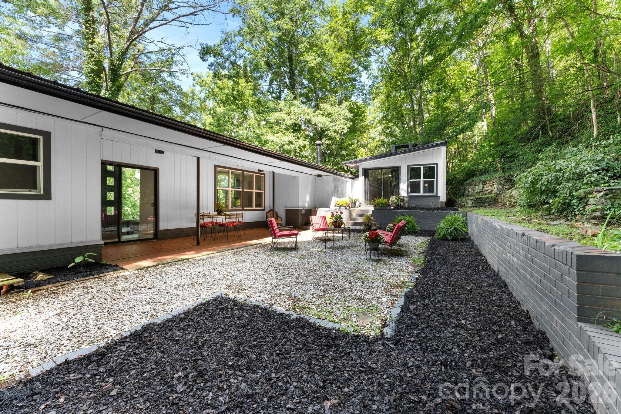 Covered Patio & Gravel Courtyard Patio In Rear - 103 Riverwood Drive, Sylva