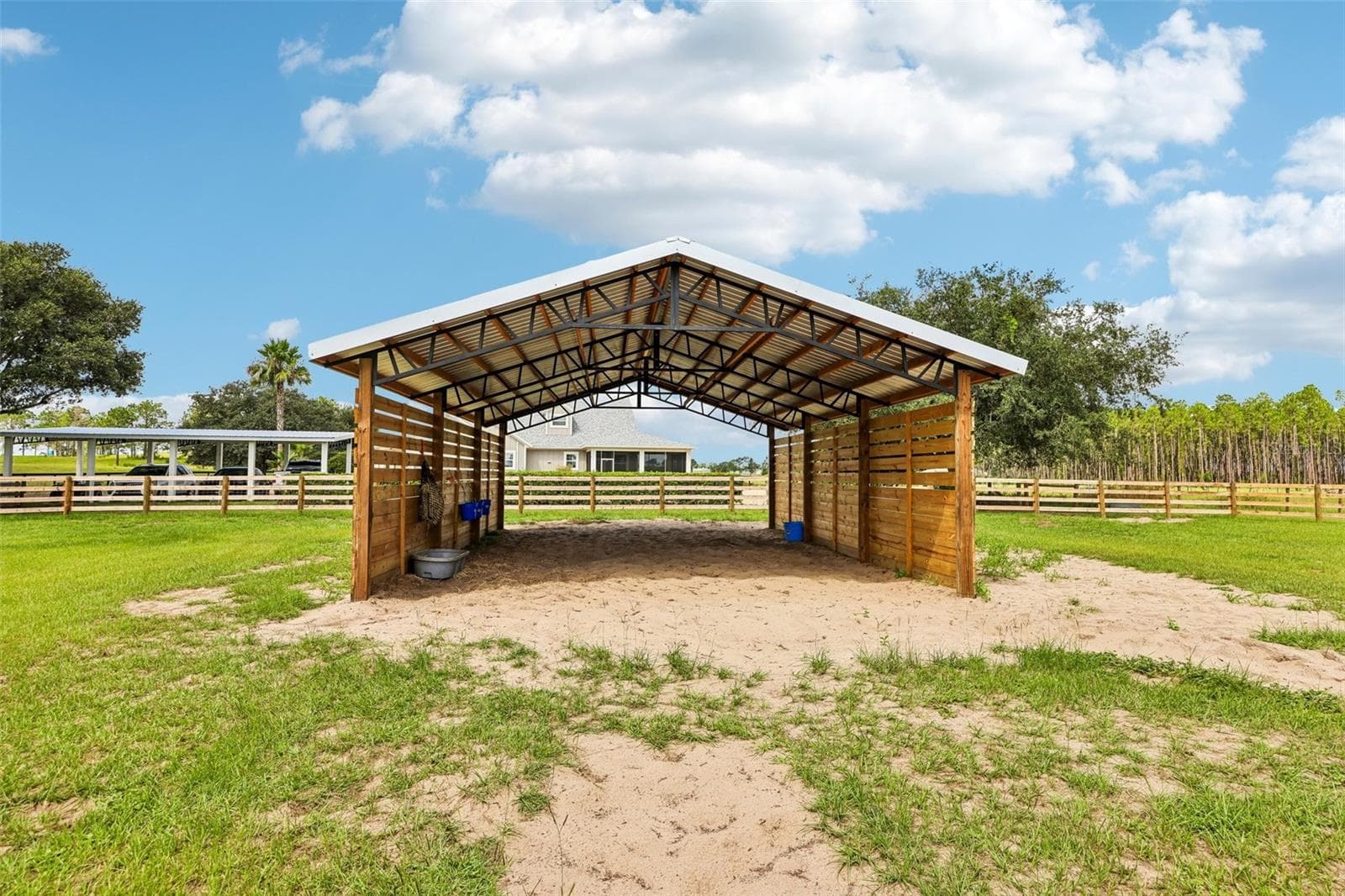 The 24x26 pole barn in Paddock #3 provides a spacious, shaded run-in area for horses during turnout. - 2088 NW 102ND BLVD, WILDWOOD