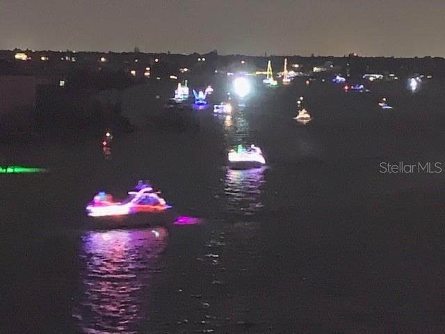 balcony watching boat parade - 9495 BLIND PASS RD #504, ST PETE BEACH