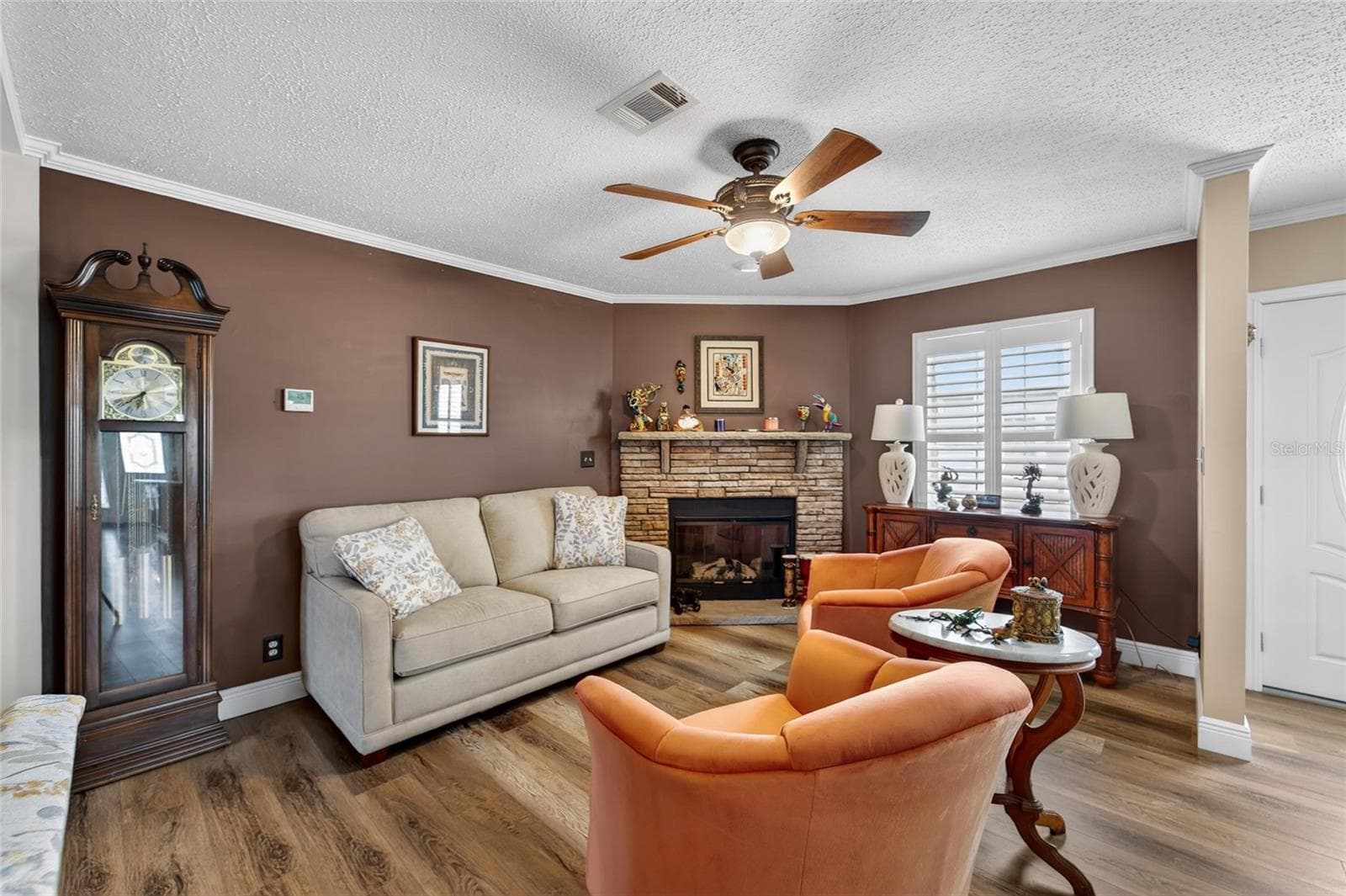 Living room with fireplace - 10039 STERLING AVE, DADE CITY