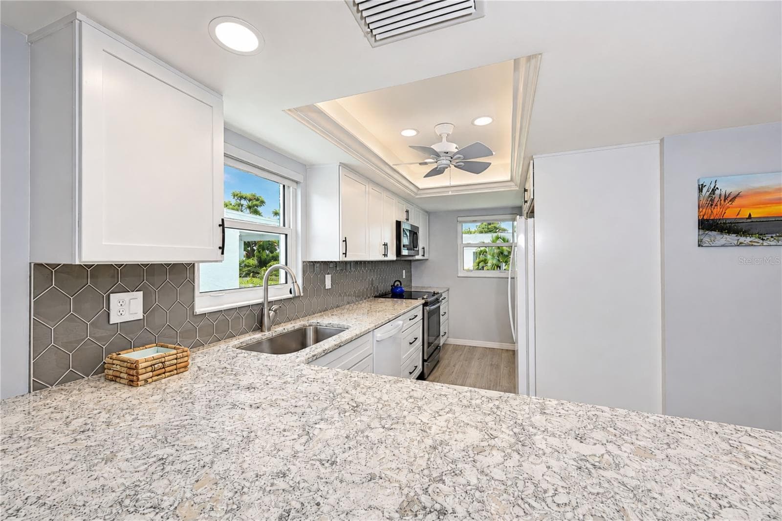 View of kitchen over breakfast bar - 9411 CONCORD CIR, BRADENTON