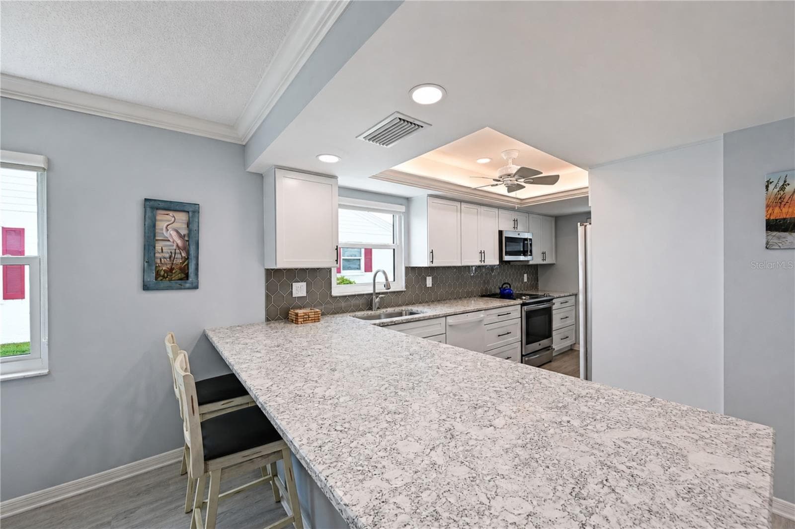 View of kitchen breakfast bar - 9411 CONCORD CIR, BRADENTON